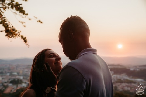 Couple at sunset in Braga, Portugal, embracing at Bom Jesus do Monte.