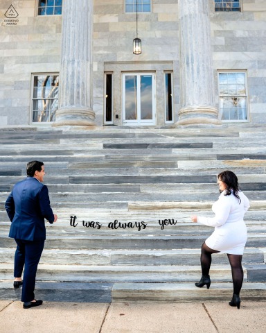A portrait capturing the tender connection between a couple walking up steps at Naval Square. Their subtle gestures and gazes convey the sentiment, 'It was always you,' emphasizing their unwavering devotion.