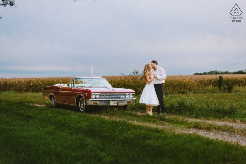 In Gambrills, Maryland, this vibrant sunset portrait shows the couple dancing joyfully in front of a vintage car, with a power tower visible behind them, adding a unique, rustic element to their romance.