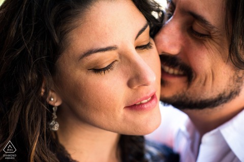 This tight, close-up portrait in Mexico City captures the couple with her eyes closed, as he lovingly comes in to kiss her cheek, creating an intimate and tender display of affection.
