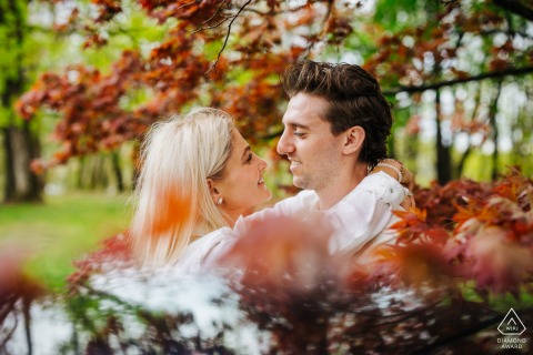 At Vanderbilt Mansion in New York, the couple is face to face, surrounded by blooming spring flowers both overhead and reflected beautifully below.