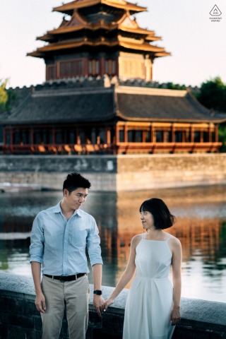 Corner Tower Engagement Portrait: Couple Sharing Eye Contact in Beijing At the Corner Tower in Beijing, China, a couple shares eye contact while posing for a portrait.