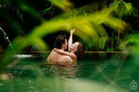 Seeking a way to cool down as things get hot, the couple enjoys a refreshing and playful interaction during their engagement session at the luxurious Hotel Chable Playa Del Carmen.