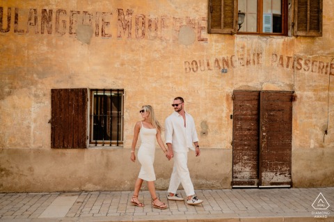 Walking through a historic old arbor in Cassis, France, the couple enjoys a quiet and intimate stroll surrounded by the timeless beauty and coastal atmosphere of the French Riviera.