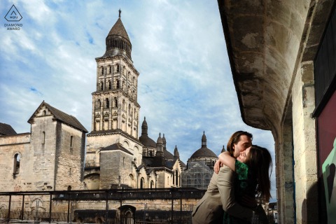 Peaceful Engagement Portrait Of Couple Standing Next To Historic Building In Charming Perigueux Dordogne France This couple embraces quietly while standing next to a historic building in Périgueux, Dordogne, enjoying a peaceful and intimate engagement portrait within the charming architectural heritage of southwestern France.