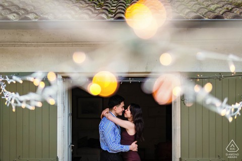 Couple Holds Each Other Closely In Historic Doorway Under Soft Evening Light At Chateau Des Senechaux This couple holds each other closely in a historic doorway at Château des Sénéchaux, Bourdeilles, Dordogne, as the soft evening light fills the scene with a warm and romantic glow.