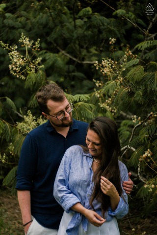 This intimate couple portrait captures a quiet connection between two lovers during their engagement session along the stunning beaches and tropical landscapes of Guarujá, São Paulo, in Brazil.