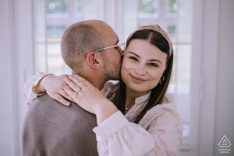 Couple pose for an engagement portrait at the Villa im Park in Meinerzhagen, NRW, Germany.