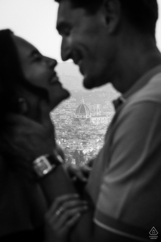 The joy of this couple is captured gently out of focus at Belmond Hotel Villa San Michele, with the historic Florence Duomo standing crisp and timeless in the distant background.