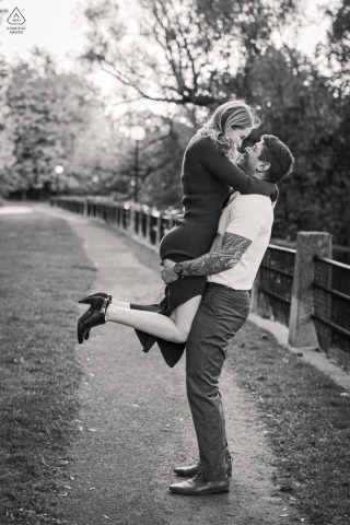 Practicing a lift for their upcoming first dance, the couple enjoys a spirited session in the Ottawa, Ontario park where they originally proposed to one another in Canada.