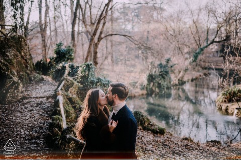 A couple stands together in Milan just before the end of their portrait and proposal session, their closeness highlighted by the nature backdrop as they savor one last quiet pause during their special day.