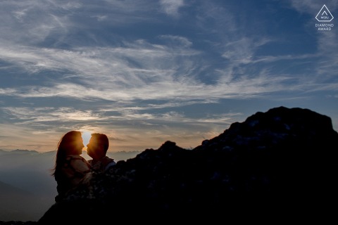 Lovers Share A Candid Interaction Highlighted By Soft Evening Light At La Pierre Percee In France Lovers share a candid and authentic interaction at the end of the day at La Pierre Percee, France, as the soft evening light highlights their genuine affection for each other.