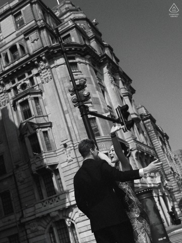 On The Bund In Shanghai The Couple Laughs And Hugs In A Joyful Street Portrait On the Bund in Shanghai, China, they laugh and hug freely on the city street, arms outstretched, making a joyful portrait that feels celebratory and alive.