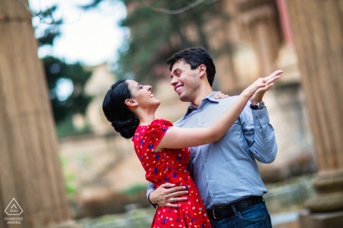 Historic Ruins Set The Stage For A Dancing Couple In San Francisco, California A couple dances atop the historic ruins of San Francisco, California, during a pre-wedding engagement session filled with movement and timeless romance.