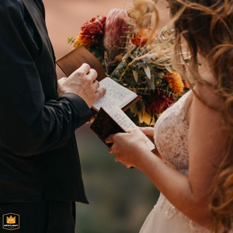 A bride and groom exchange vows outdoors in a serene Sedona, Arizona wedding, captured in a candid documentary detail image.