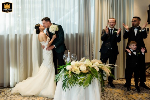 In Sofia, Bulgaria, a bride and groom share their first kiss after the ceremony at the Grand Hotel Milenium.