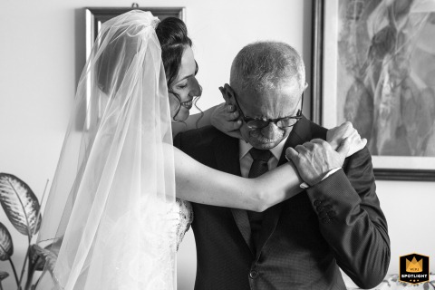 In Tollo, Chieti, Abruzzo, Italy, a silent tear traces the father's face as his daughter, now a bride, evokes emotion stronger than words.