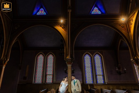 At New Restauration Church, Yarmouthport, Massachusetts, a quiet, playful glance between ancient stained glass windows and wooden arches becomes a lasting memory.