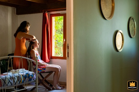 In Nouvelle-Aquitaine, the bride undergoes her beauty preparation, captured by a WPJA photographer.