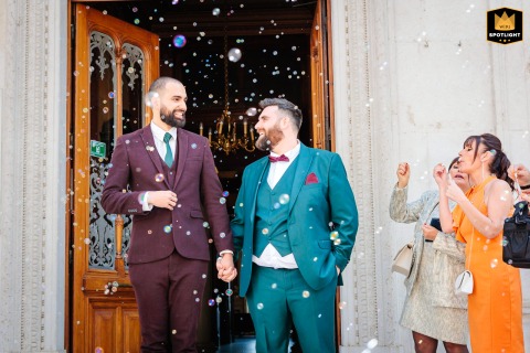 At Tullins town hall, France, the civil ceremony concludes as bubbles and confetti fly over the exiting couple.