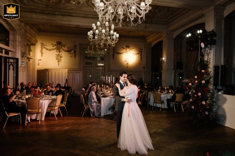 In Istanbul's Pera Palace Hotel, the couple shares their first dance alone, illuminated by low light in the royal venue.