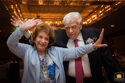 At Hotel Omni Mont Royal in Montreal, QC, Canada, the groom’s parents enthusiastically join the dance floor, sharing joyful moves and celebrating alongside the newlyweds.