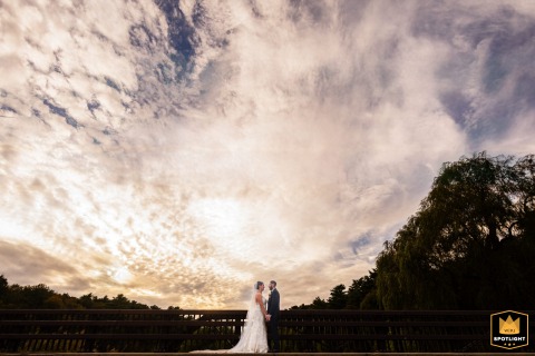 At Jones River Trading Post, the couple shares a quiet portrait session beneath a breathtaking sky, their connection beautifully framed by the sweeping grandeur of nature all around them.