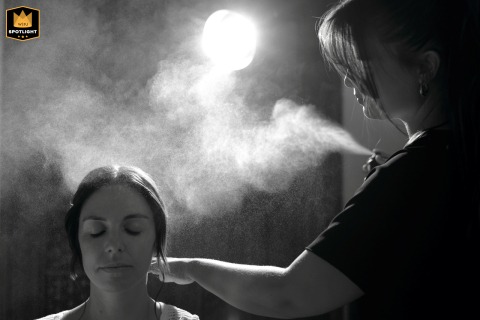 At Domaine de Lalane in Occitanie, France, the bride’s preparations are beautifully captured as her hairstyle is carefully arranged. 