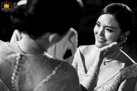 At Grand Hyatt Erawan, a touching black and white moment unfolds as the mother-in-law gently touches the bride’s face. This intimate gesture beautifully captures warmth, acceptance, and the tender bond growing between two families on the wedding day.
