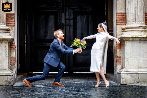 Outside Toulouse’s city hall, the newlyweds emerge playful after their civil ceremony. 
