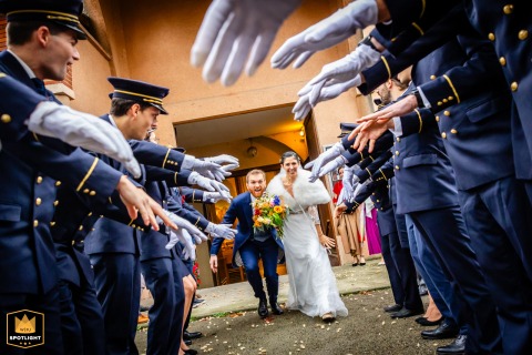 Outside a church in Toulouse, the newlyweds step out together just after their ceremony. Surrounded by joyful well-wishers, their faces glow with happiness, marking the beginning of their shared journey in this cheerful image.