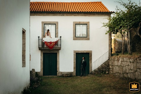 At Quinta do Amendo in Portugal, the bride and groom are featured within the beautiful windows and doors of an old house. The architectural layout frames them perfectly.