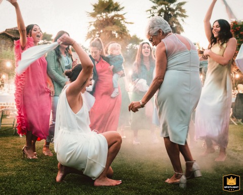 In Bragança, Portugal, the bride and her mum have a blast with the girls. The joyous scene captures their fun and lively celebration together.