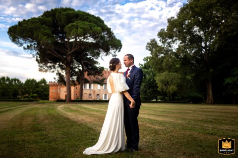 In Haute-Garonne, France, a couple's portrait showcases their loving bond. The photograph highlights the intimate love between them.