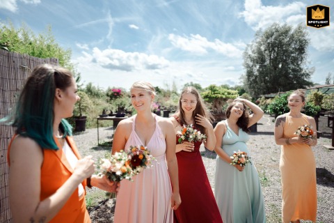 Bridesmaids wait to make their entrance at Bonsai Zentrum in Heidelberg, Germany. The quiet moment captures their anticipation and excitement just before the wedding ceremony begins.