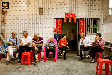 A joyous and harmonious scene unfolds at a rural wedding in Guangdong Province, China. The community gathers to celebrate, capturing a beautiful moment of unity and happiness.