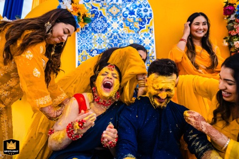 An Auspicious Start: Ahmedabad Family Blesses Their Bride with Turmeric Haldi Ceremony Haldi ceremony in Ahmedabad. Family members apply turmeric paste to the bride to prepare her for her Indian wedding.