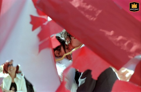 Romance In Ravenna: A Kiss Through A Heart-Shaped Arch A couple kisses through a heart cutout in Ravenna, Emilia Romagna, Italy, at their wedding.