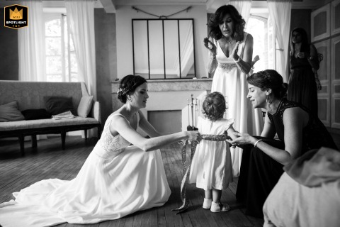 Witnesseses, a Bride, and a Young Girl at Domaine du Beyssac Black and white photo of a young girl with the bride and witnesses at Domaine du Beyssac.