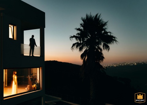 Cliffside in Ericeira, Portugal: A Newlywed Couple's Blue Hour Portrait Blue hour portrait of a newlywed couple posing on separate levels in Ericeira, Portugal.