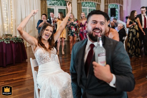 The Groom Searches for a Drink, Not the Garter, in the Magnolia Room. Groom hilariously searches for a drink instead of the garter in the Magnolia Room, Rock Hill, SC.
