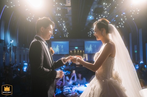 Love's Promise Sealed: Taiwanese Couple Exchanges Rings at Peng Yuan Banquet Hall Taiwanese couple exchanges rings at Peng Yuan Banquet Hall in Taipei, a moment of love and commitment.