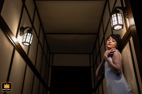 Quiet Moments After "I Do": A Bride's Reflections at The Winslow House Bride stands in a softly lit hallway at The Winslow House in Orleans, lost in the moment after her wedding ceremony.