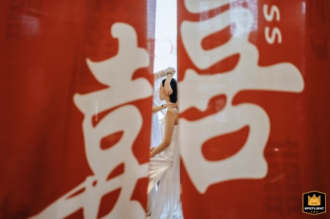 Behind a "Double Happiness" Curtain: A Bride Prepares for Her Wedding Day Bridal preparations behind a "囍" curtain in Xinxiang, China.