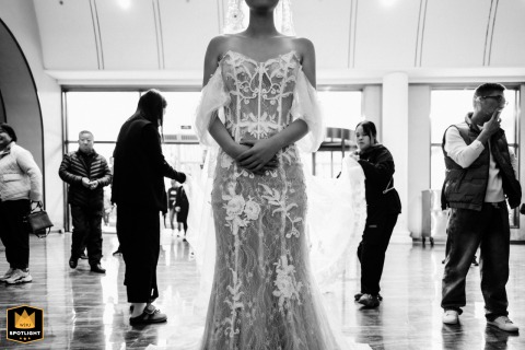Beautiful Kaifeng Bride: Awaiting Her Wedding in a Traditional Chinese Qipao A beautiful Chinese bride in a traditional qipao waits outside a traditional Kaifeng building for her wedding.
