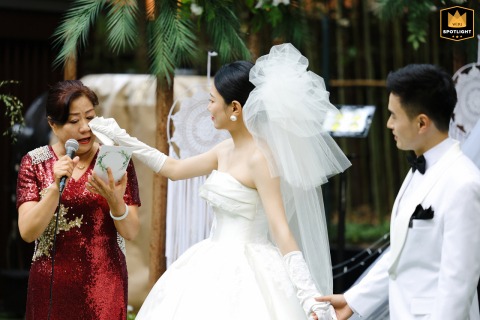 Tears of Joy and Love: A Bride Comforts Her Mother in Shanghai Touching moment as a bride at Siya Cuisine, Shanghai, wipes her mother's tears during a heartfelt speech.