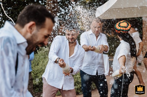 Wedding Bliss in Villa Bodo: A Groom and His Friends Celebrate in Italy Groom and friends celebrating at a wedding reception at Villa Bodo, Italy.