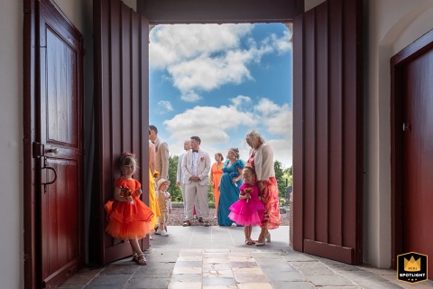 A Quiet Anticipation: Guests Gather for a Groom in a Lille Church Guests await the groom outside Église Saint-Maurice de Lille before the religious ceremony.