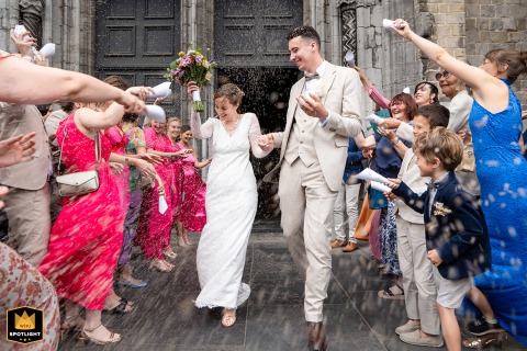 Lavender Rain of Love Showers Couple Exiting a Church in Lille The newlyweds are showered with lavender as they exit the church in Lille, Nord, France, after their ceremony.
