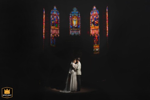 Cattedrale Dei Servi: A Tuscan Wedding Portrait Bathed in Siena's Stained Glass Tuscan wedding portrait of a couple in Siena's Cattedrale dei Servi with large stained glass windows.